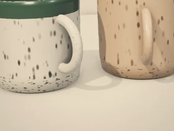 Phone photo of two speckled mugs