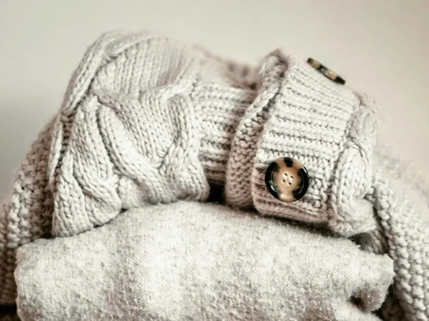 Cream cable-knit cardigan with tortoiseshell buttons