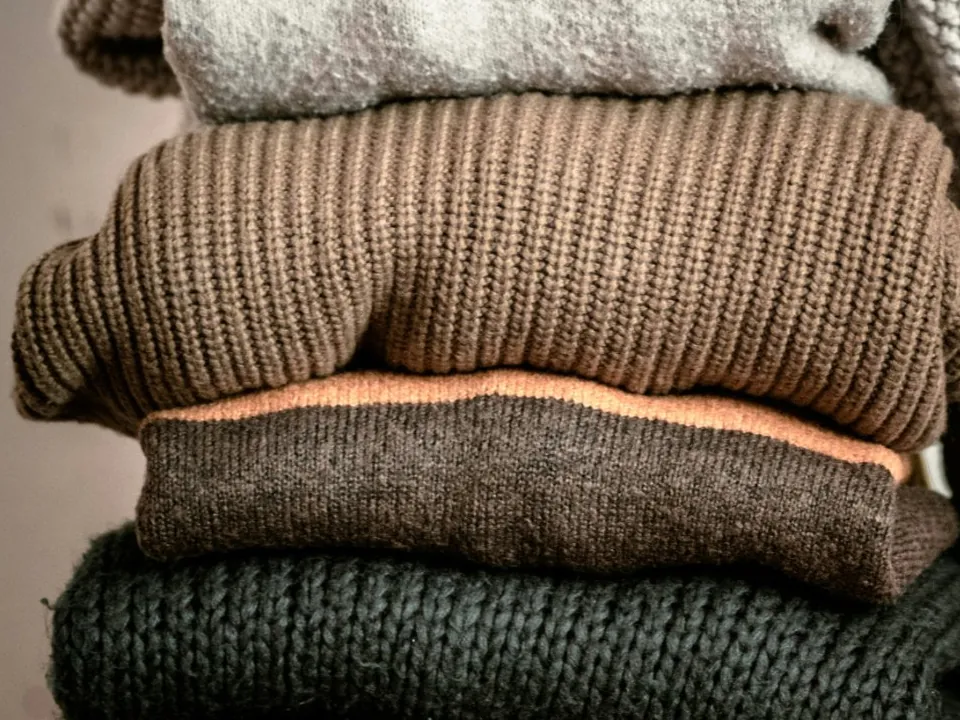 Folded brown ribbed jumper