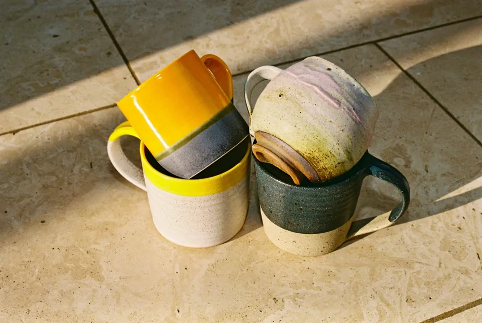 The shop&rsquo;s photo of four hand-thrown stoneware mugs